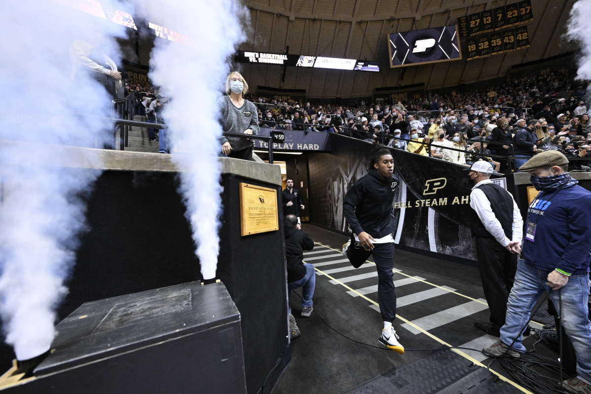 Jaden Ivey runs through the Purdue tunnel before the Nicholls State game.
